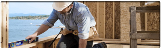 Construction Worker Building a House