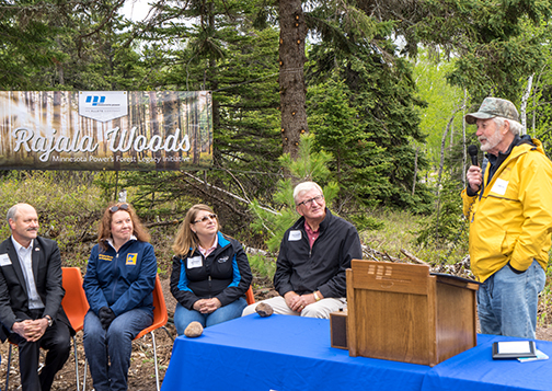 Al Hodnik, ALLETE CEO; Lori Dowling-Hanson, Minnesota DNR; Deb Amberg, ALLETE senior vice president, general counsel and secretary; and Jack Hedstrom of Hedstrom Lumber listen as Jack Rajala speaks about the importance of white pines and other conifer trees.