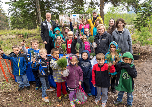 Birch Grove students show they’re ready to plant white pine seedlings.